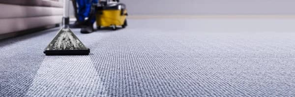 Professional carpet cleaning with industrial equipment in a Perth office