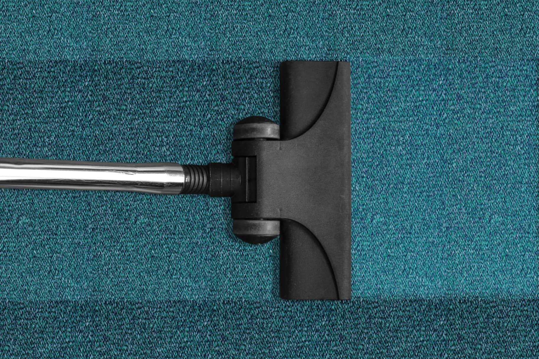 Vacuum cleaner on commercial carpet during end of lease clean
